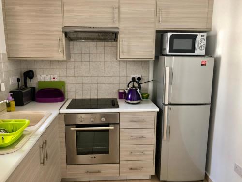 주방, Mythical Sands Resort, Protaras, Choose Joy Apt in 파랄림니