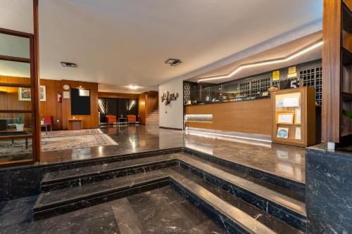 奧爾加皇后酒店 (Queen Olga Hotel) in 新海灘區