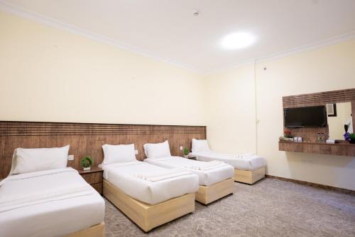 Quadruple Room with Private Bathroom image 1