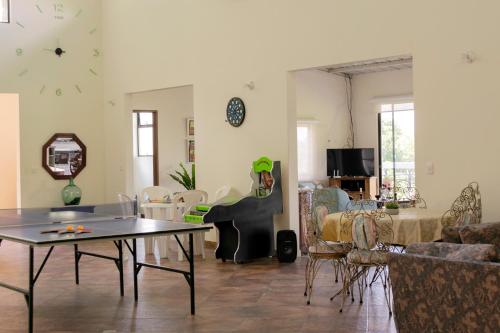 Koplietošanas atpūtas telpa ar TV, Villa Romero Hospedaje in Nocaima