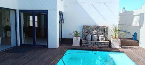Swimmingpool, Relax in Style at Ndigo Blue, Langebaans Coziest Holiday Home in Calypso Beach
