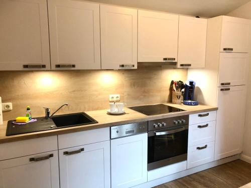 kleine meerZeit, sußes Knusperhauschen mit Kaminofen in Landkirchen