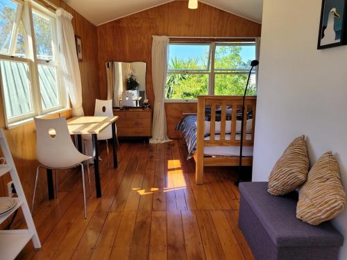 This peaceful, serene cabin overlooks Nelson with views out to the sea in Nelson South