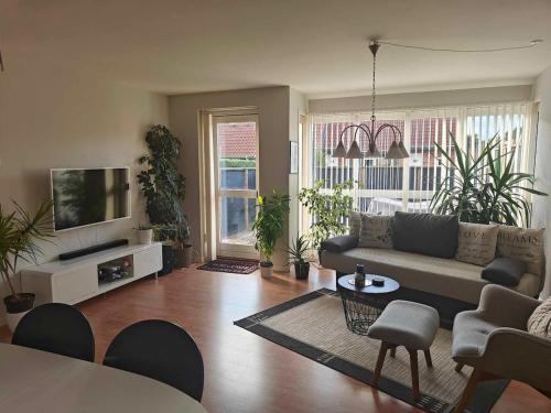 Shared lounge/TV area, Charming ROOM in a Cozy Home in Stege in Udby