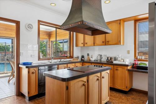 Boomerang Retro 70s Family Home Waterfront Pool in Bundall