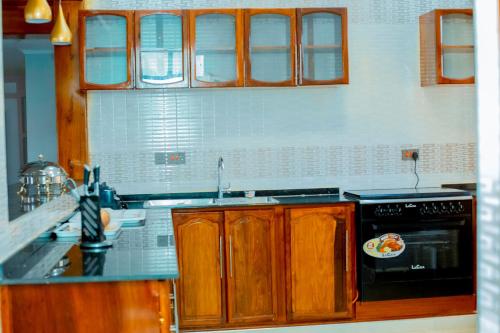 virtuve, MARK-A VACATION Home in Kigoma