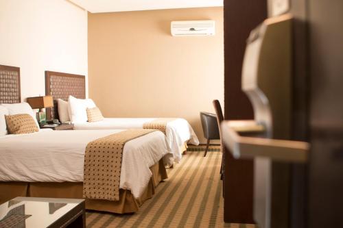 Guestroom, Rincon del Valle Hotel & Suites in Mata Redonda