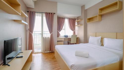 Cozy Stay and Warm Studio Apartment at Margonda Residence 5 By Travelio