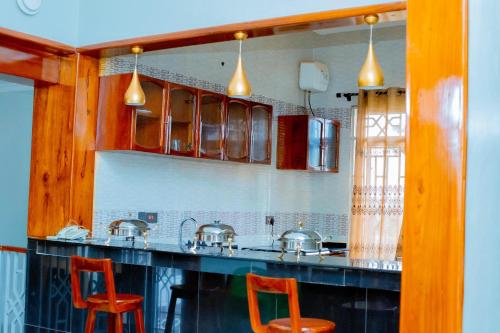 virtuve, MARK-A VACATION Home in Kigoma