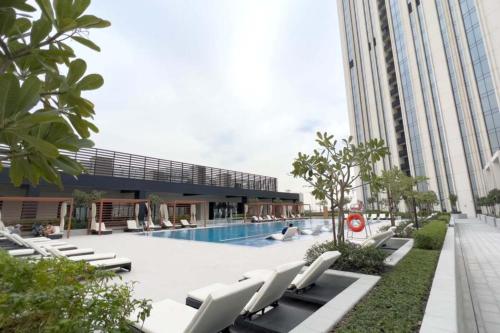New 1BR in Creek Island with Balcony Pool and Gym - main image