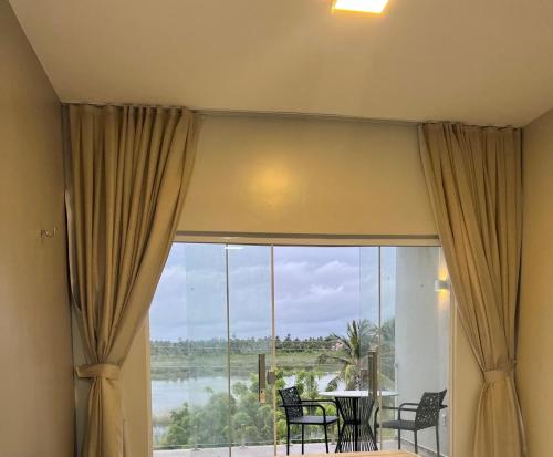 陽台/露台, Villa brisa icaraizinho Quarto 6 andar superior in 阿蒙塔達