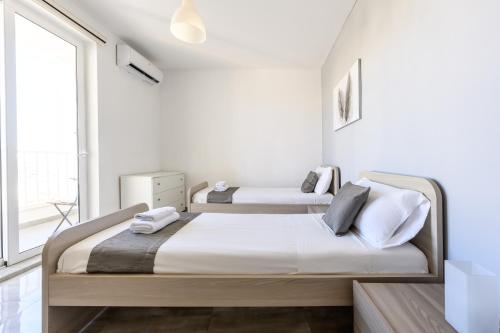 F9 Room 3, Private Room two single beds with shared bathroom in shared Flat, Msida (fotografie 7)