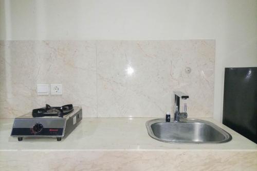 1BR with Cozy Design at Uttara The Icon Apartment By Travelio 1BR with Cozy Design at Uttara The Icon Apartment By Travelio