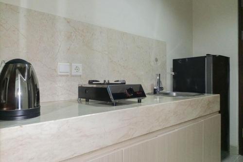 1BR with Cozy Design at Uttara The Icon Apartment By Travelio 1BR with Cozy Design at Uttara The Icon Apartment By Travelio