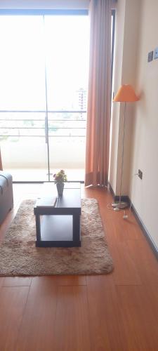 Refugio Urbano, garzonier moderno con balcón y garaje