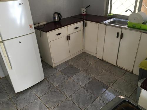 廚房, 世界大同旅館 (One World Village Guesthouse) in 丹尼斯角