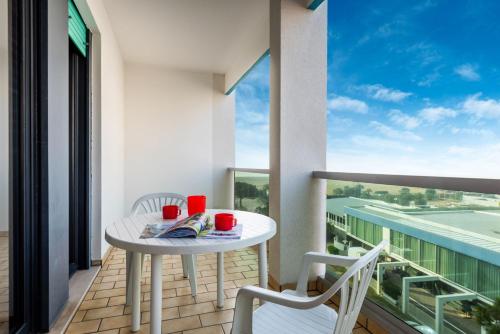Apartment room in Modern seafront apartment with pool and terrace