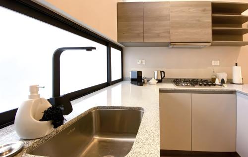 One-Bedroom Apartment with Balcony and City View image 10