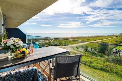 BeachWaveThree- 2OG, barrierearm, Meerblick, Balkon, Kamin, Sauna in Olpenitz, Deutschland