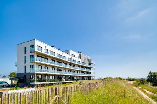 Exterior view, BeachViewOne- 3OG, Meerblick, Balkon, Kamin, Sauna in Olpenitz
