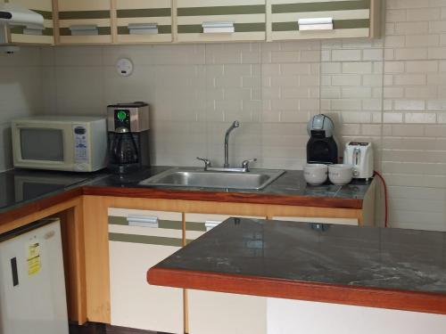 Kitchen, Exclusivo Aparto Suite California CC Lider near Climbing in Parque de Recreación Cuevas del Indio
