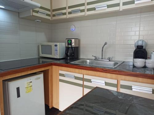 Kitchen, Exclusivo Aparto Suite California CC Lider near Climbing in Parque de Recreación Cuevas del Indio