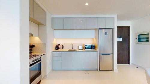 Vacationer Holiday Homes I Airy 1 Bedroom l Beach Access l Emaar Beachfront, Dubai (Foto 4)