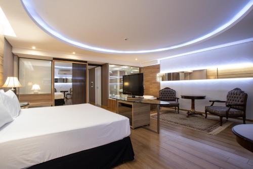 ห้องส่วนกลางสำหรับนั่งเล่น/ดูทีวี, เรกันโต กาตารารัส เทอร์มัส รีสอร์ตแอนด์คอนเวนชั่น (Recanto Cataratas Thermas Resort & Convention) in กัมโปส โด อีกัวชู