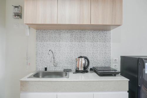 Nice and Cozy Studio at Evenciio Margonda Apartment By Travelio - image 5