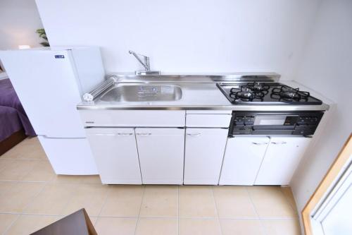 오키나와 본섬 うるまドーム沖縄 Mercury2 & Venus3 (うるまドーム沖縄 Mercury2 & Venus3) 3성급 게스트하우스 레스토랑