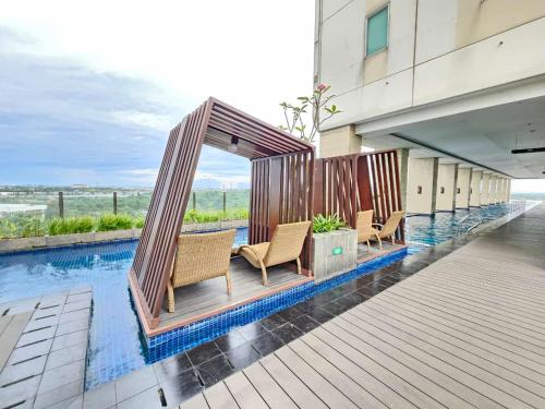 Swimming pool, B Residence BSD By LiviRooms Tangerang in Pagedangan