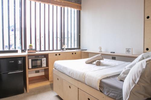 HomeBase Apartment Hotel - Tap to explore photos