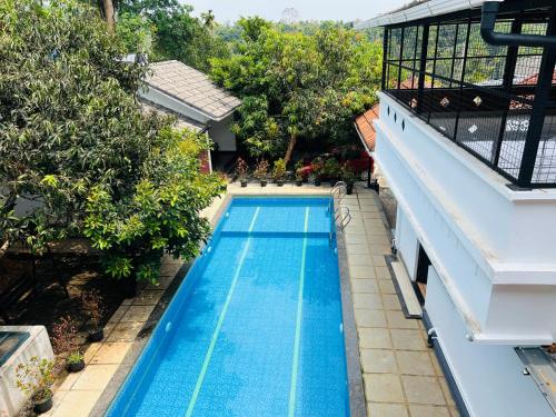 Empire One Bedroom with Common Pool in Muttil