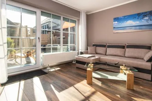 Ferienwohnanlage ODINs Blick - Wohnung 17 - direkt am Privatstrand, mit Sauna, Garten in Lobbe, Deutschland