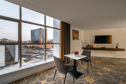 Shared lounge/TV area, Abha Gardn Millennium Hotel in Abha