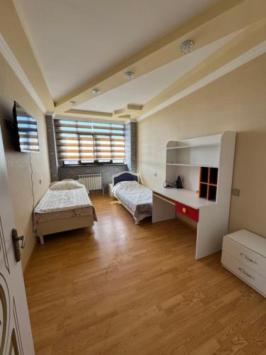 Three-Bedroom Apartment with Balcony