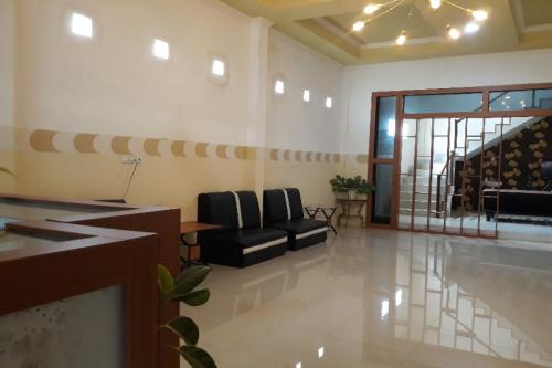 Лоби, OYO 91162 Homestay Ansyariah Syariah in Talise