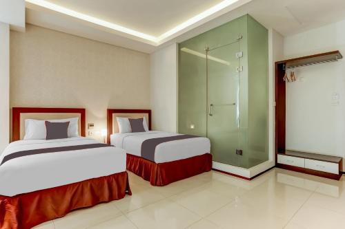 Delxue Twin Room room in Collection O Legian Near Pantai Kuta Formerly Premium Legian