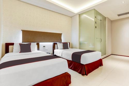 Superior Twin Room room in Collection O Legian Near Pantai Kuta Formerly Premium Legian