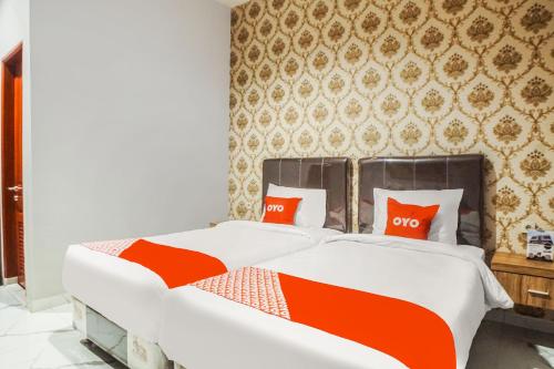 Super OYO Capital O 92066 Papakoel Hotel & Cafe Room Type - Delxue Twin Room