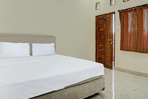 Capital O 92316 Wisma Widya Loka Pratama Near Futsal Tebing Gading in South Ogan Komering Ulu