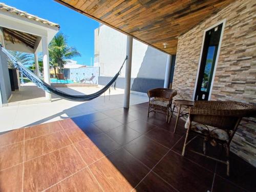 Casa com 3 suítes em Cabo Frio com piscina há poucos passos do Mar! (Casa com 3 suites em Cabo Frio com piscina ha poucos passos do Mar!) in Unamar
