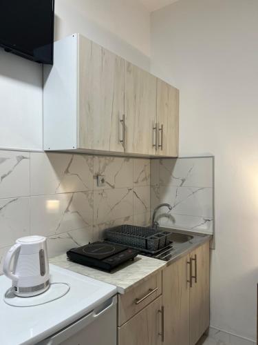 virtuve, Apartmani Ćosić - Kuršumlijska banja (Apartmani Cosic - Kursumlijska banja) in Kursumlija
