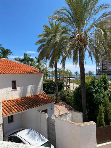 Chalet adosado con jardín - Primera linea gîte à louer Playa de Jeresa