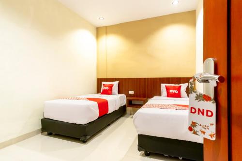 Standard Twin Room room in Capital O 1585 Ring Road Residence