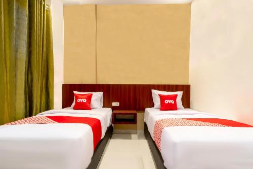 Delxue Twin Room room in Capital O 1585 Ring Road Residence