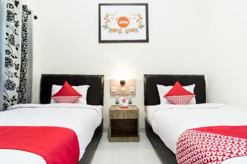 Standard Twin Room room in Capital O 873 Kamani Homestay Syariah