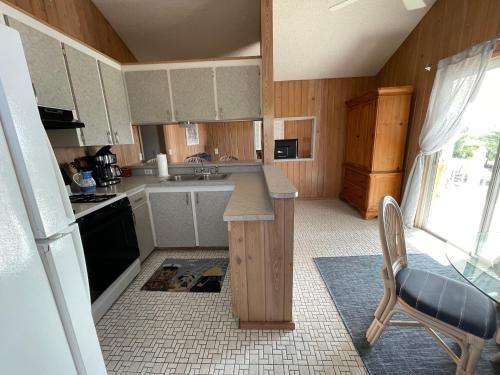 Easy Breezy - Waterfront Beach Bungalow with 150 Foot Dock on Guana Cay and Waterside Pergola in Great Guana Cay