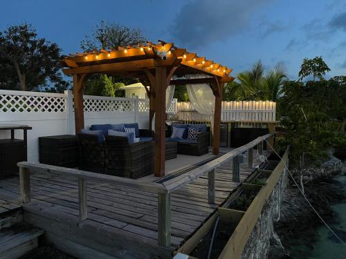 Easy Breezy - Waterfront Beach Bungalow with 150 Foot Dock on Guana Cay and Waterside Pergola in Great Guana Cay