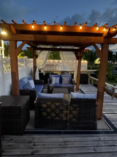 Easy Breezy - Waterfront Beach Bungalow with 150 Foot Dock on Guana Cay and Waterside Pergola in Great Guana Cay